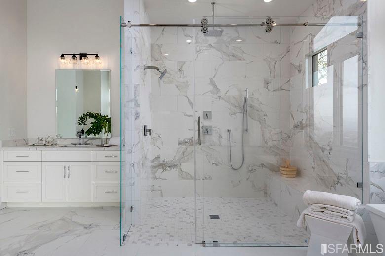 5 Winding Oaks Drive Pleasanton, CA 94566 - Photo 57 of 72 a bathroom with a granite countertop shower sink vanity and mirror