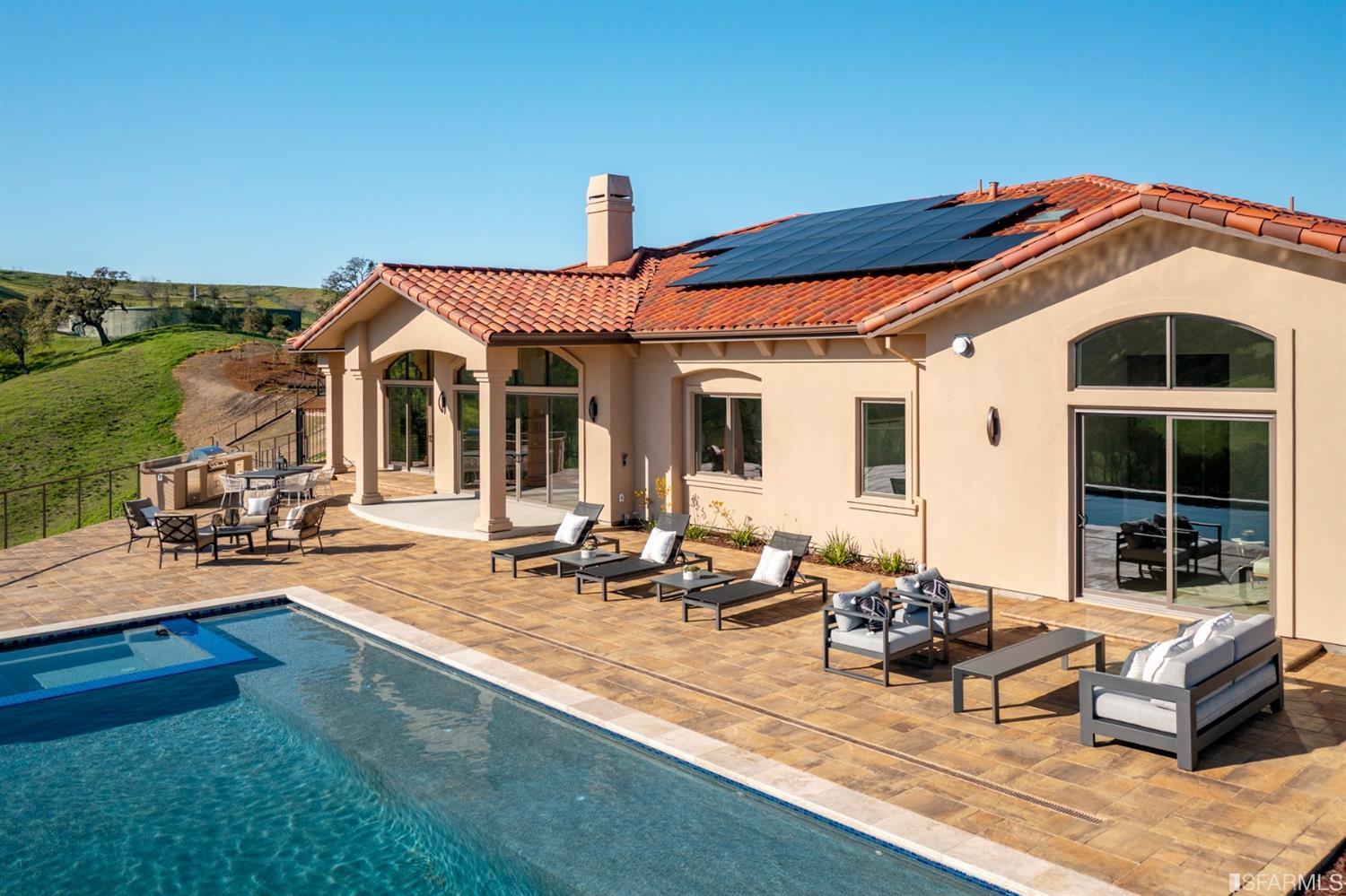 5 Winding Oaks Drive Pleasanton, CA 94566 - Photo 60 of 72 a front view of a house with swimming pool and sitting area