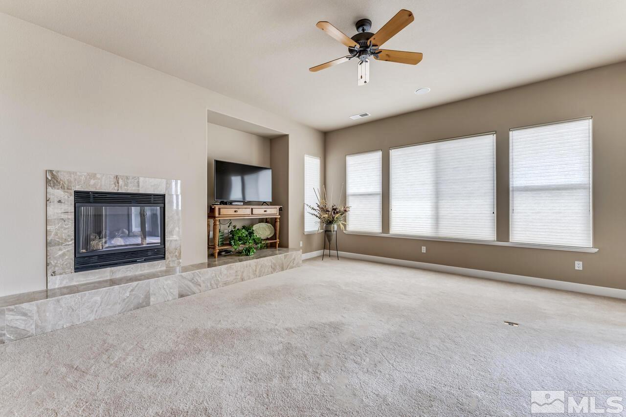1816 Laurel Ridge Drive Reno, NV 89523 - Photo 17 of 40 an empty room with windows and fireplace