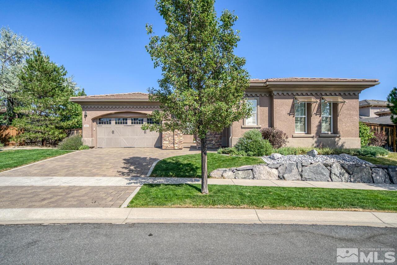 1816 Laurel Ridge Drive Reno, NV 89523 - Photo 2 of 40 a front view of a house with a yard and a garage