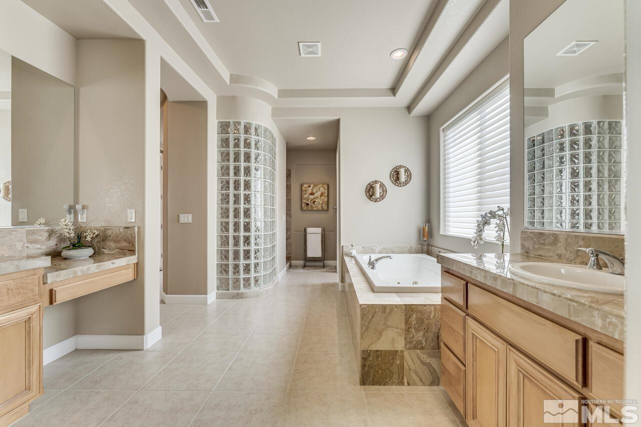 1816 Laurel Ridge Drive Reno, NV 89523 - Photo 27 of 40 a bathroom with a tub sink and mirror