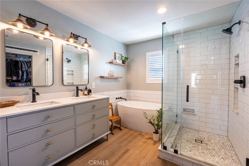 28201 Springvale Lane Castaic, CA 91384 - Photo 19 of 59 a spacious bathroom with a double vanity sink toilet mirror and bathtub