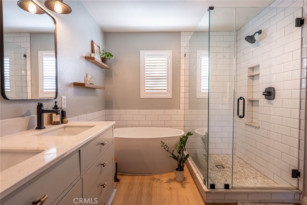 28201 Springvale Lane Castaic, CA 91384 - Photo 20 of 59 a bathroom with a tub sink and mirror