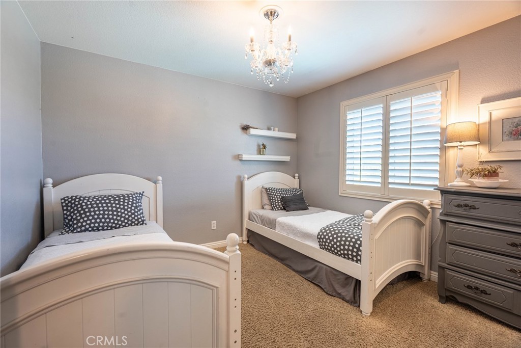 28201 Springvale Lane Castaic, CA 91384 - Photo 21 of 59 a bedroom with a bed and window