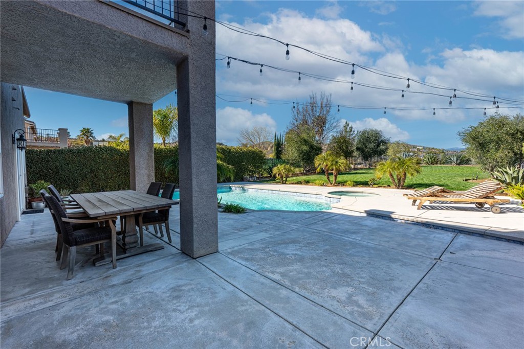 28201 Springvale Lane Castaic, CA 91384 - Photo 39 of 59 a backyard of a house with yard and outdoor seating