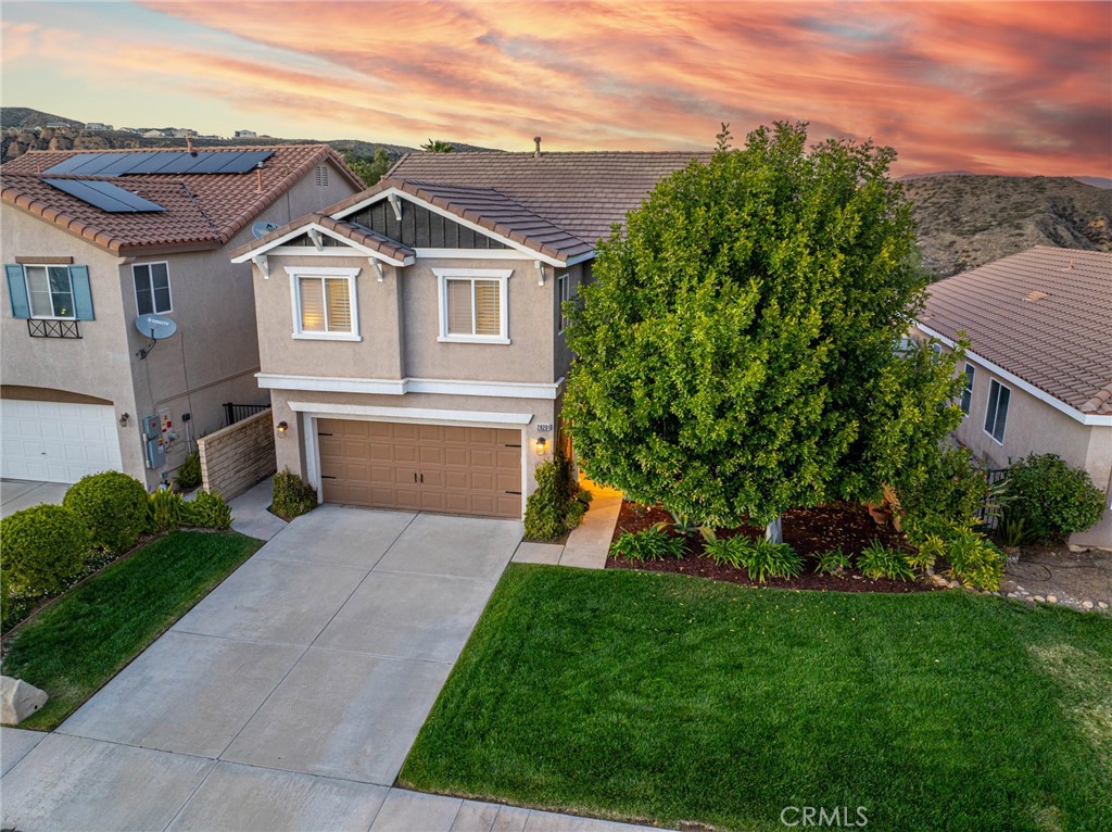 28201 Springvale Lane Castaic, CA 91384 - Photo 58 of 59 a front view of a house with a garden