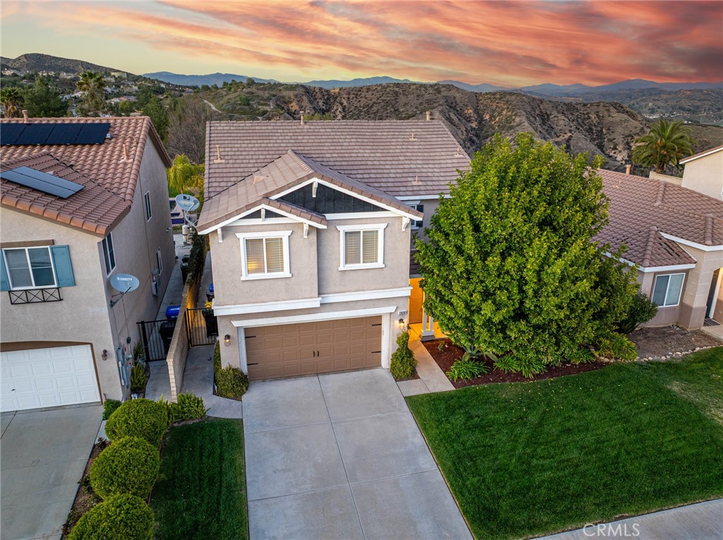 28201 Springvale Lane Castaic, CA 91384 - Photo 59 of 59 a front view of a house with a yard and mountain view