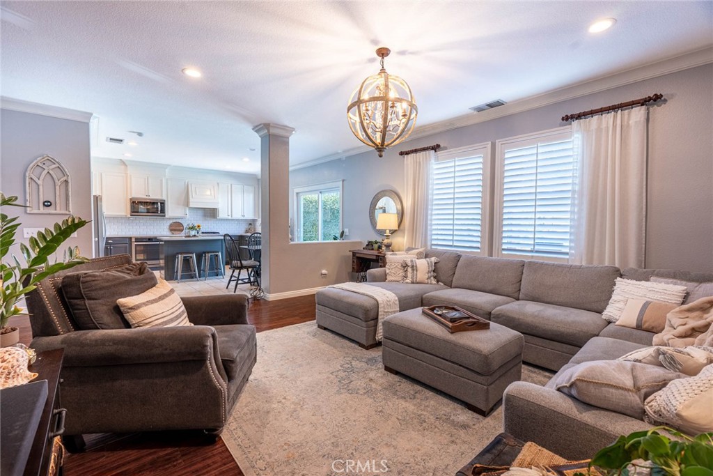 28201 Springvale Lane Castaic, CA 91384 - Photo 8 of 59 a living room with furniture chandelier and a window