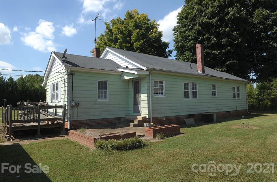 425 Barger Road Salisbury, NC 28146 - Photo 22 of 24 a view of a backyard with table and chairs with wooden fence