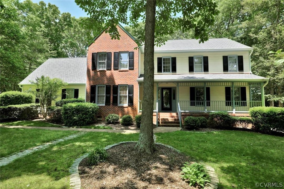 9604 St Regis Terrace North Chesterfield, VA 23236 - Photo 2 of 32 a front view of a house with a yard and porch