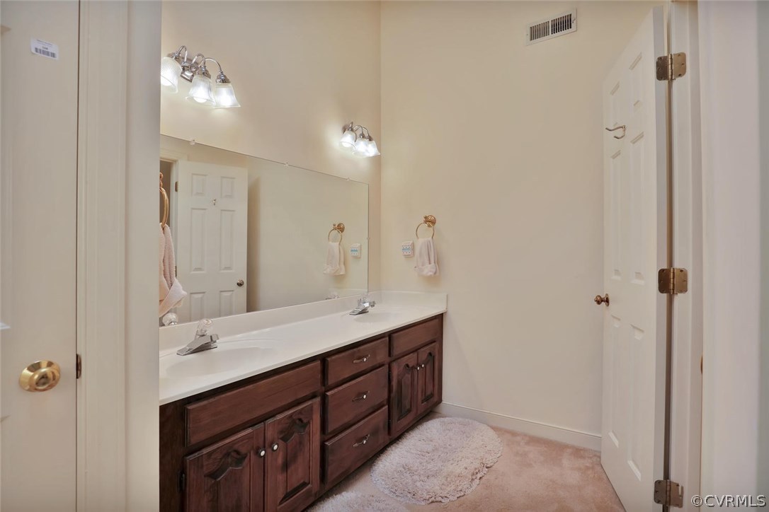 9604 St Regis Terrace North Chesterfield, VA 23236 - Photo 24 of 32 a spacious bathroom with a double vanity sink a mirror and a shower