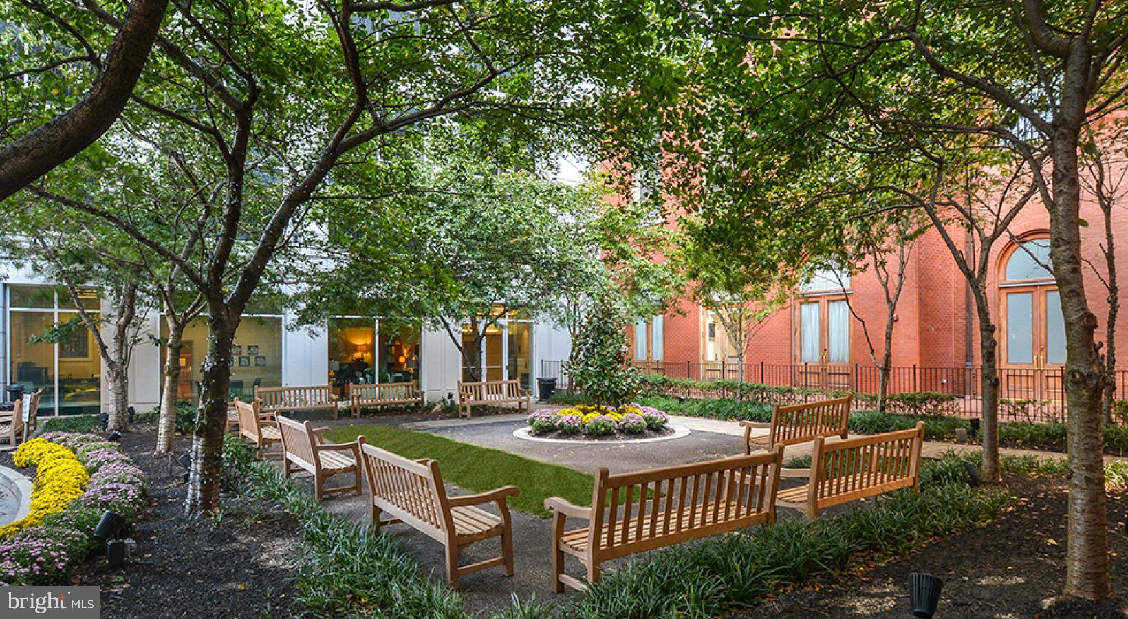 204 West Washington Square, Unit 1301 Philadelphia, PA 19106 - Photo 15 of 19 a view of a patio with couches table and chairs and potted plants