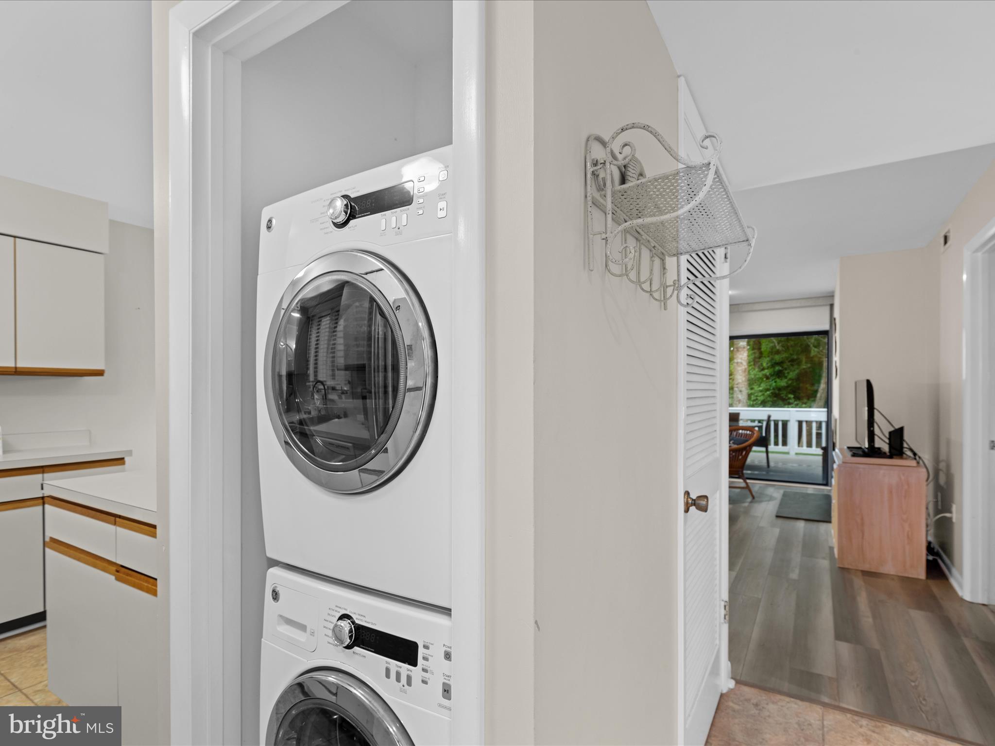 39346 Racquet Lane, Unit 8504 Bethany Beach, DE 19930 - Photo 19 of 40 a view of a hallway with washer and dryer