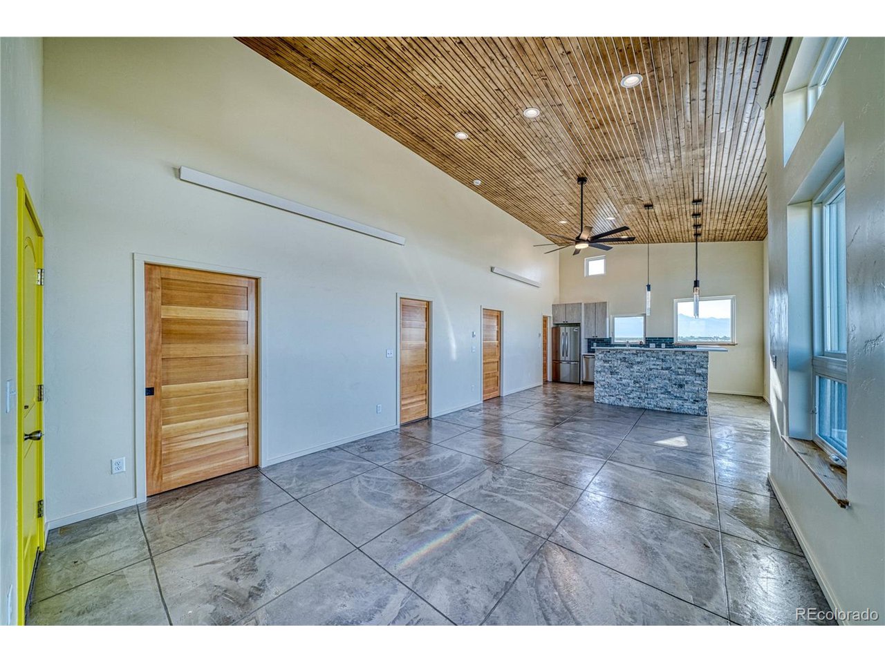 57884 Co Road Moffat, CO 81143 - Photo 16 of 40 Living space with concrete floors and pocket doors