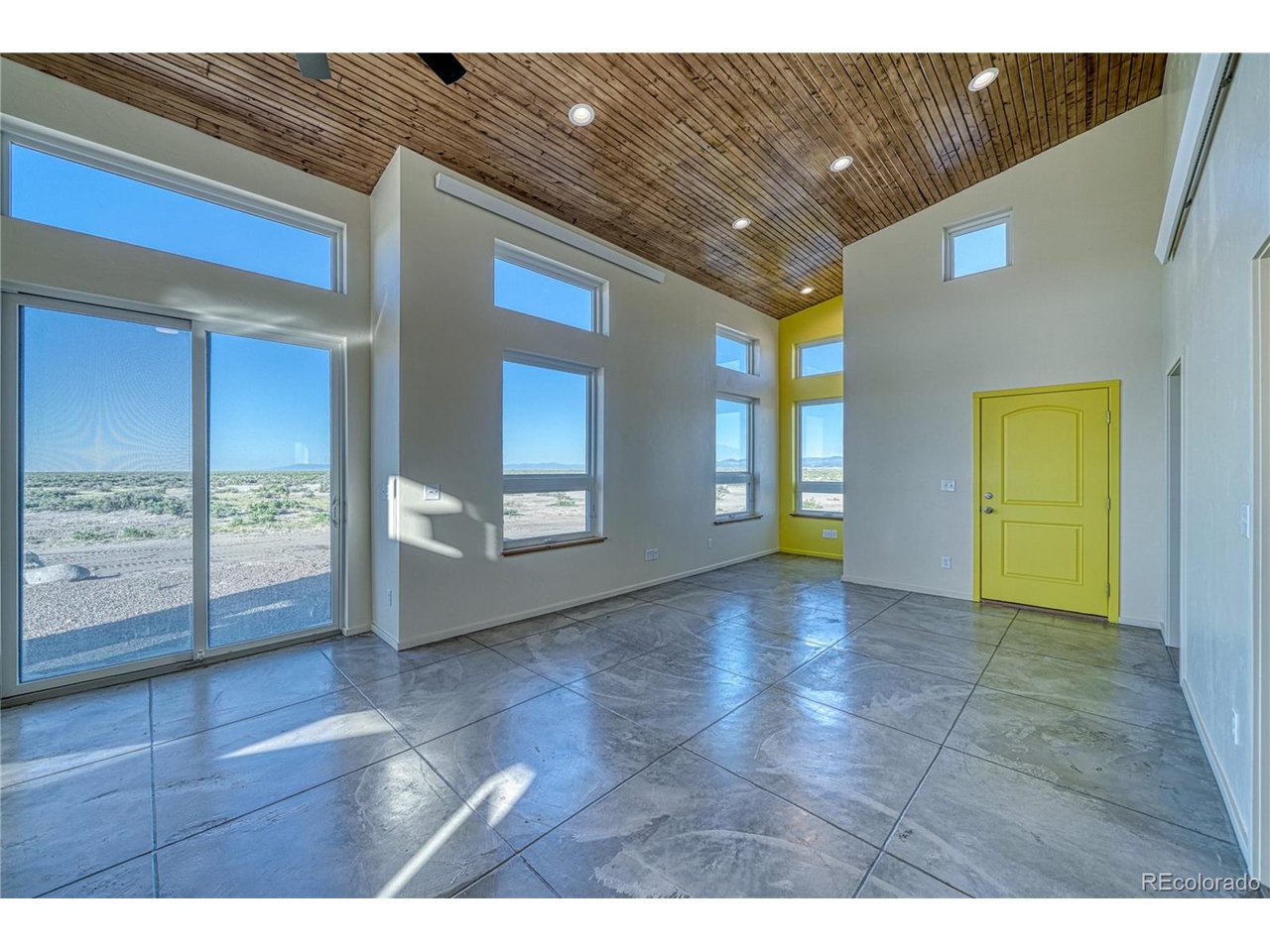 57884 Co Road Moffat, CO 81143 - Photo 17 of 40 Living Area with south-facing windows and sliding glass door