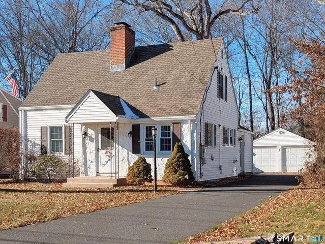 a front view of a house with garage