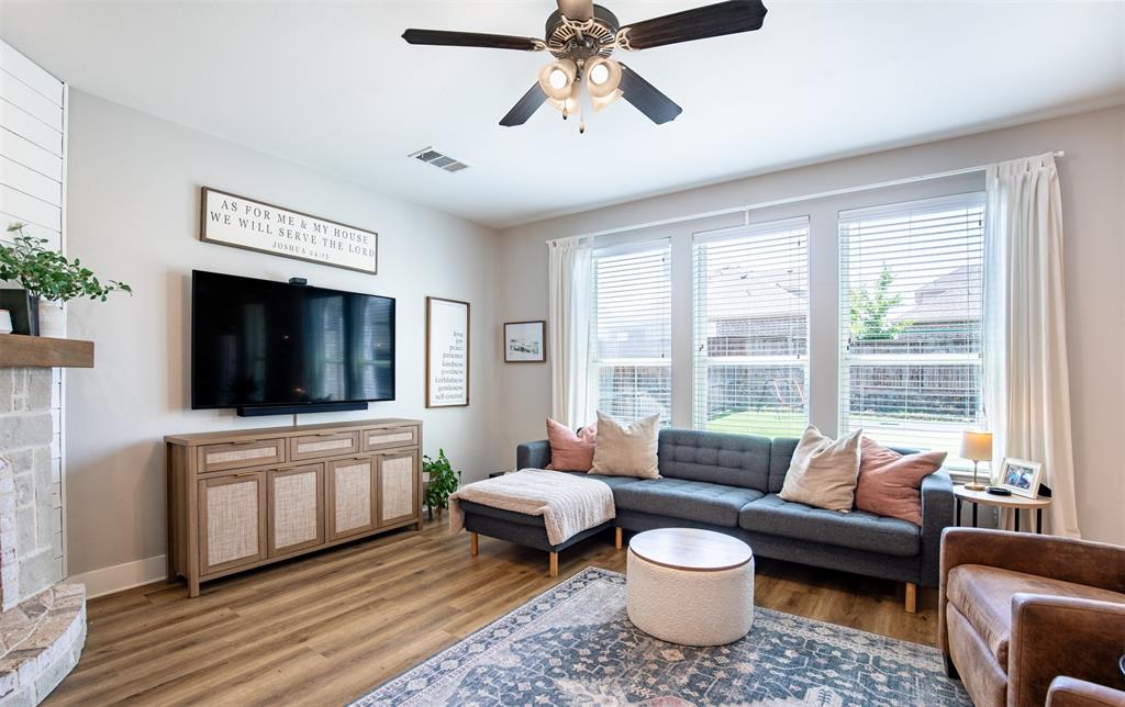 416 Allbright Road Celina, TX 75009 - Photo 7 of 40 a living room with furniture and a flat screen tv