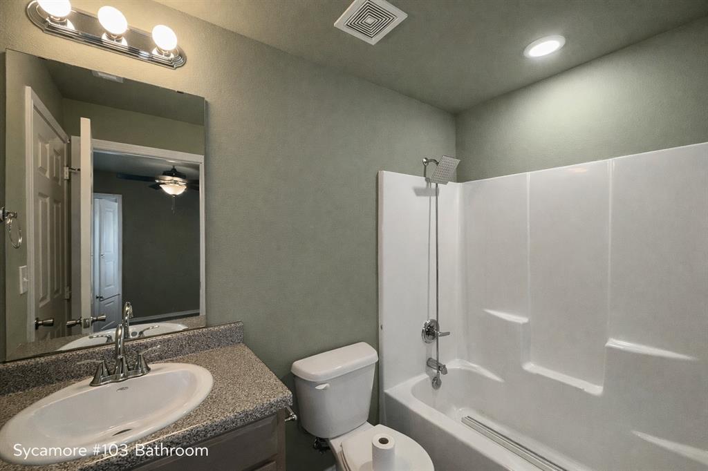 800 Sycamore Street, Unit 103 Commerce, TX 75428 - Photo 8 of 8 a bathroom with a sink toilet tub and shower