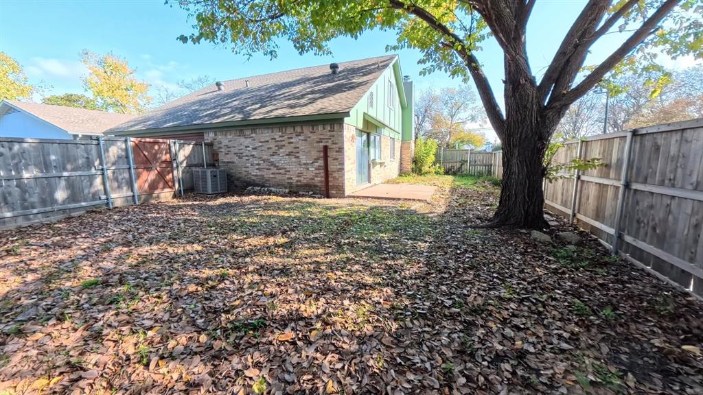 301 Gatewood Road Garland, TX 75043 - Photo 15 of 15 a view of a house with a tree in the yard