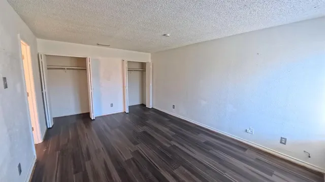 a view of a room with wooden floors and led lights
