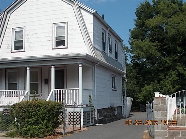 21 Blake Street Boston, MA 02136 - Photo 3 of 8 a view of a house with a yard