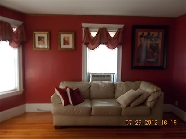 21 Blake Street Boston, MA 02136 - Photo 5 of 8 a living room with furniture and a window