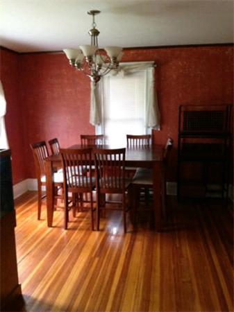 21 Blake Street Boston, MA 02136 - Photo 7 of 8 a dining room with furniture a chandelier and wooden floor