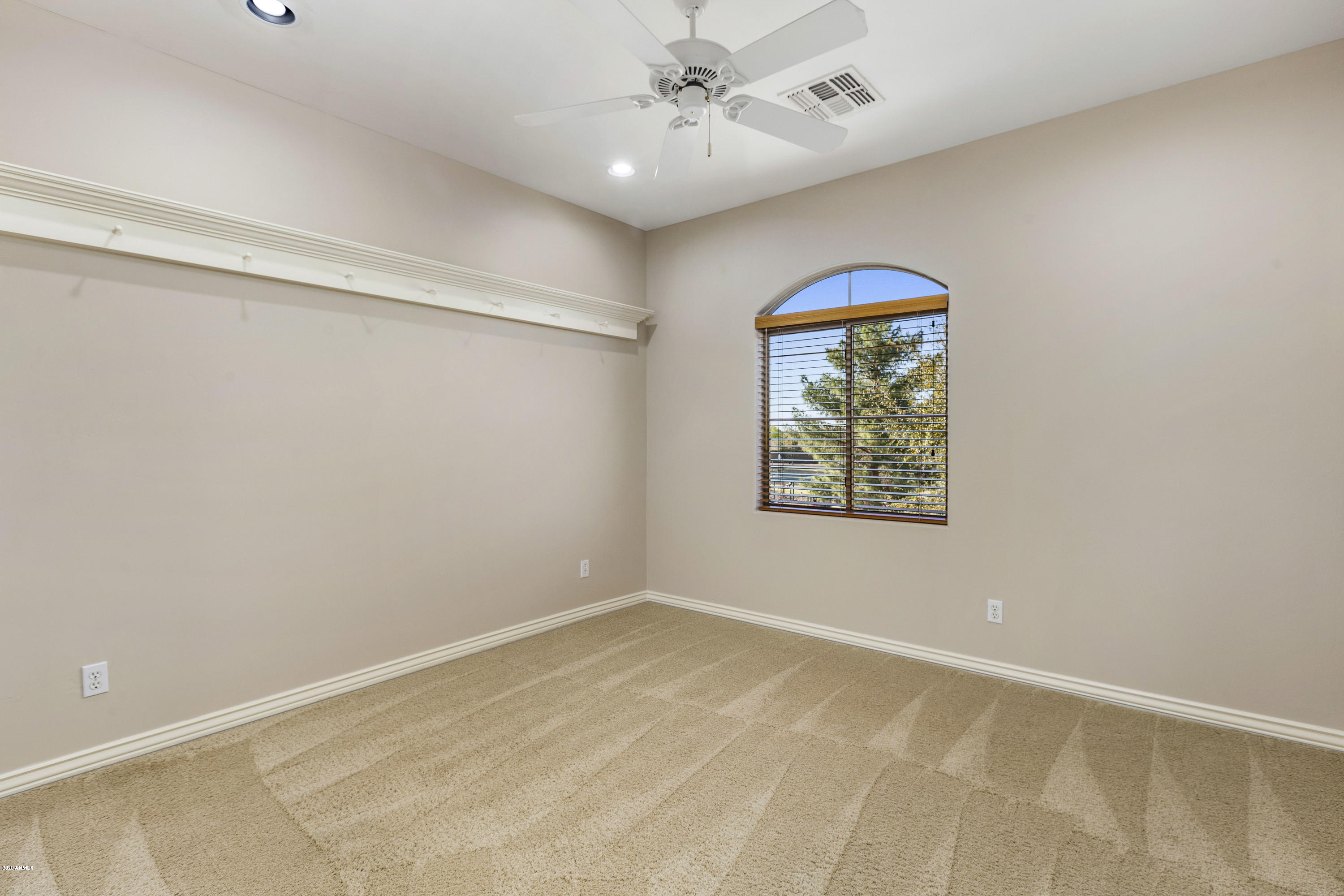 4583 East Desperado Road Gilbert, AZ 85297 - Photo 44 of 70 an empty room with windows and fan