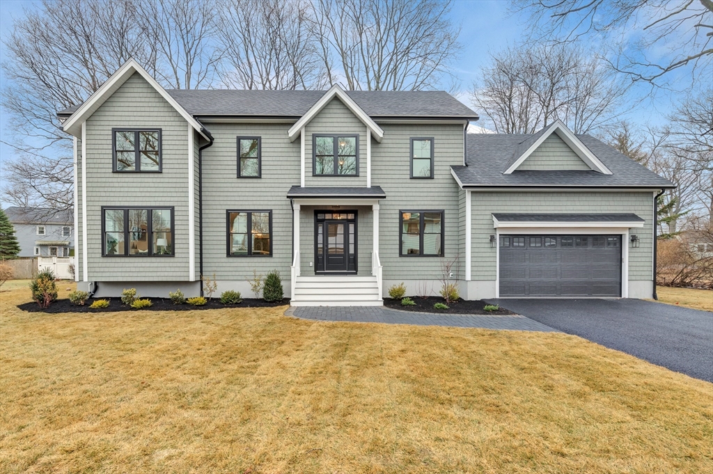19 Cherokee Road Arlington, MA 02474 - Photo 1 of 42 a front view of a house with a yard