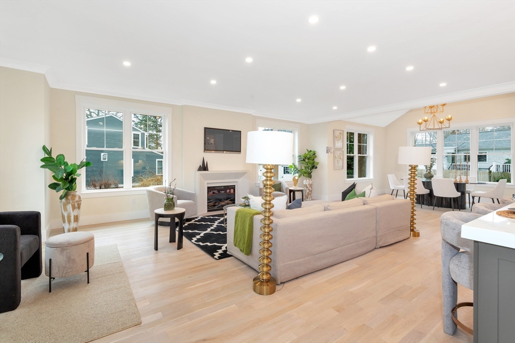 19 Cherokee Road Arlington, MA 02474 - Photo 11 of 42 a living room with furniture fireplace and a large window