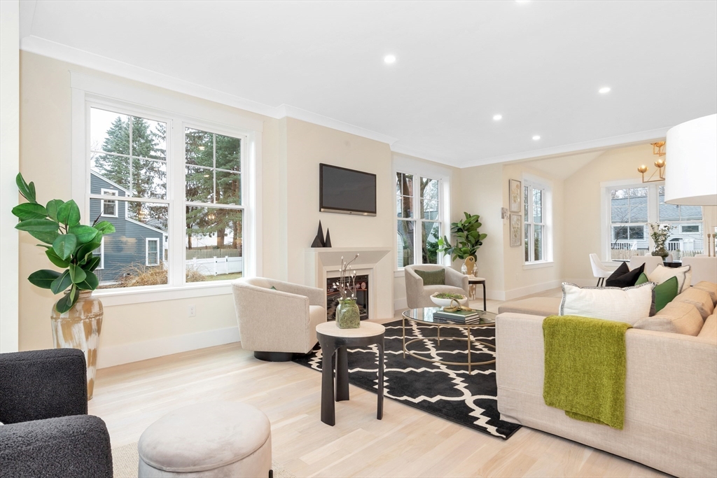 19 Cherokee Road Arlington, MA 02474 - Photo 12 of 42 a living room with furniture a window and a flat screen tv