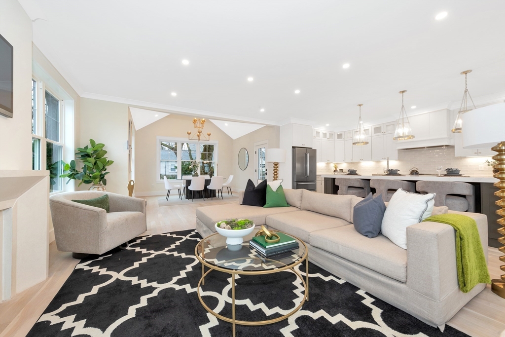 19 Cherokee Road Arlington, MA 02474 - Photo 13 of 42 a living room with furniture and kitchen view