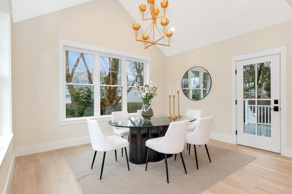 19 Cherokee Road Arlington, MA 02474 - Photo 16 of 42 a view of a dining room with furniture a chandelier and wooden floor