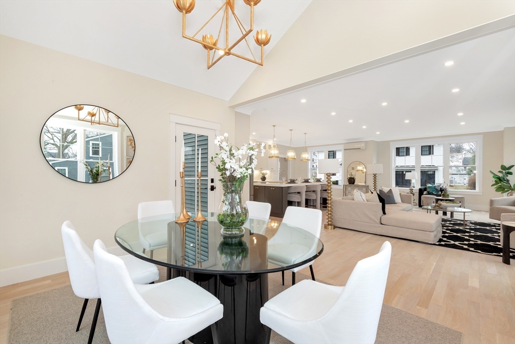 19 Cherokee Road Arlington, MA 02474 - Photo 17 of 42 a view of a dining room with furniture and a chandelier