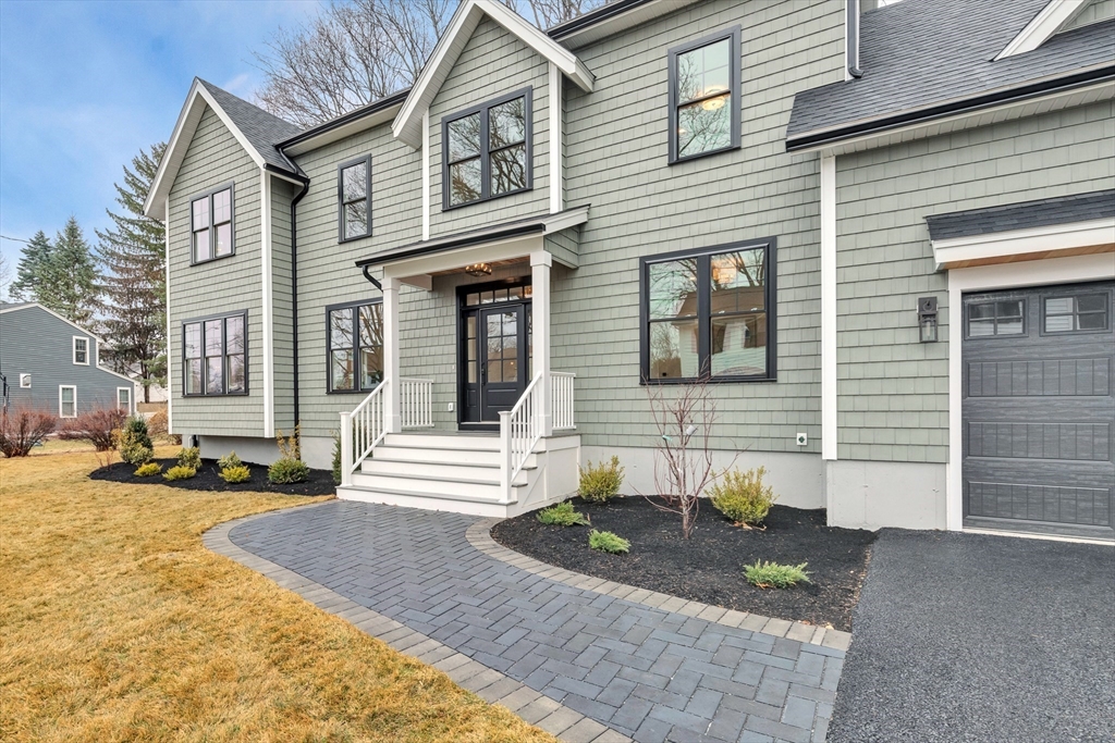 19 Cherokee Road Arlington, MA 02474 - Photo 2 of 42 a front view of a house with garden