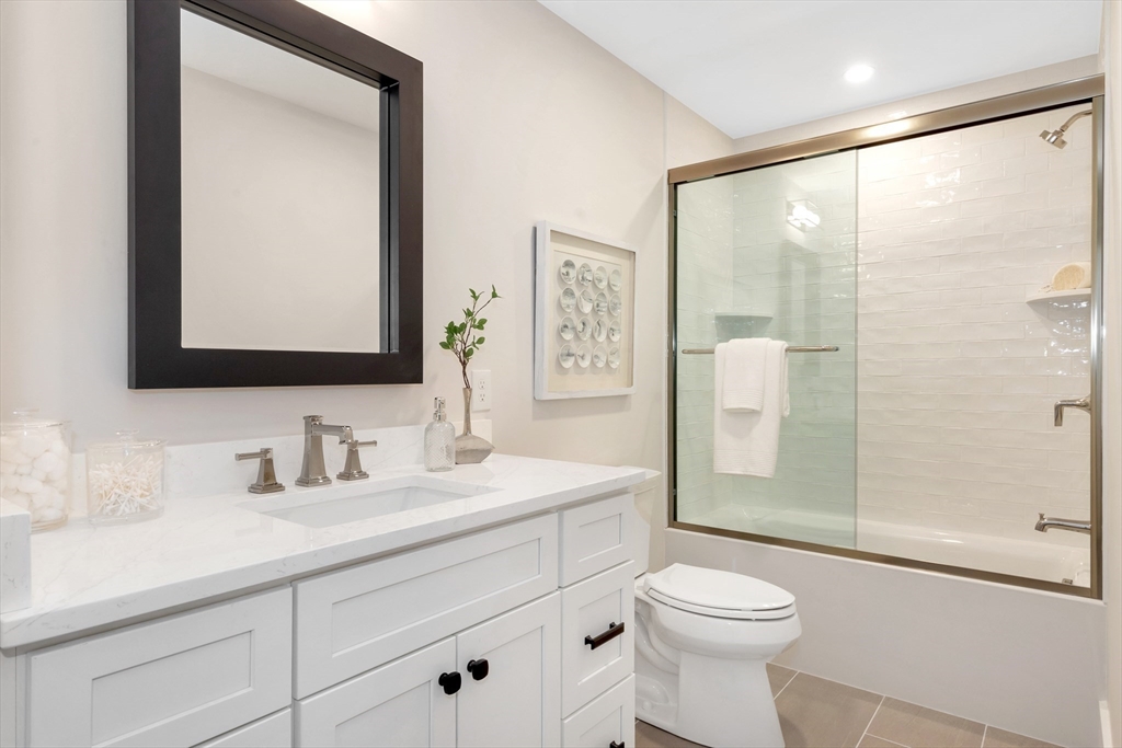19 Cherokee Road Arlington, MA 02474 - Photo 22 of 42 a bathroom with a sink a toilet and shower
