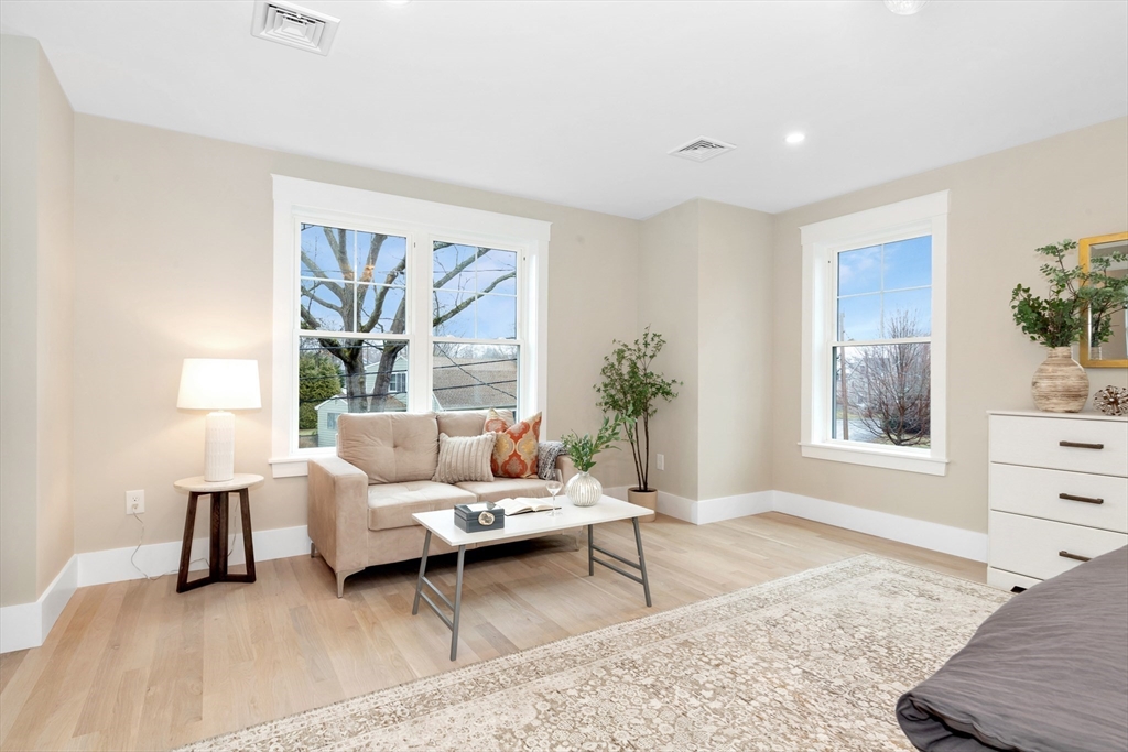 19 Cherokee Road Arlington, MA 02474 - Photo 27 of 42 a living room with furniture and a large window