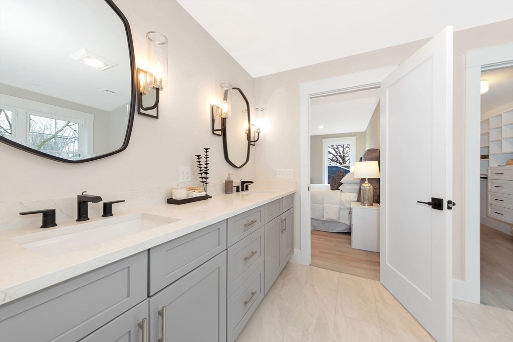19 Cherokee Road Arlington, MA 02474 - Photo 29 of 42 a en suite bathroom with a double vanity sink and a mirror