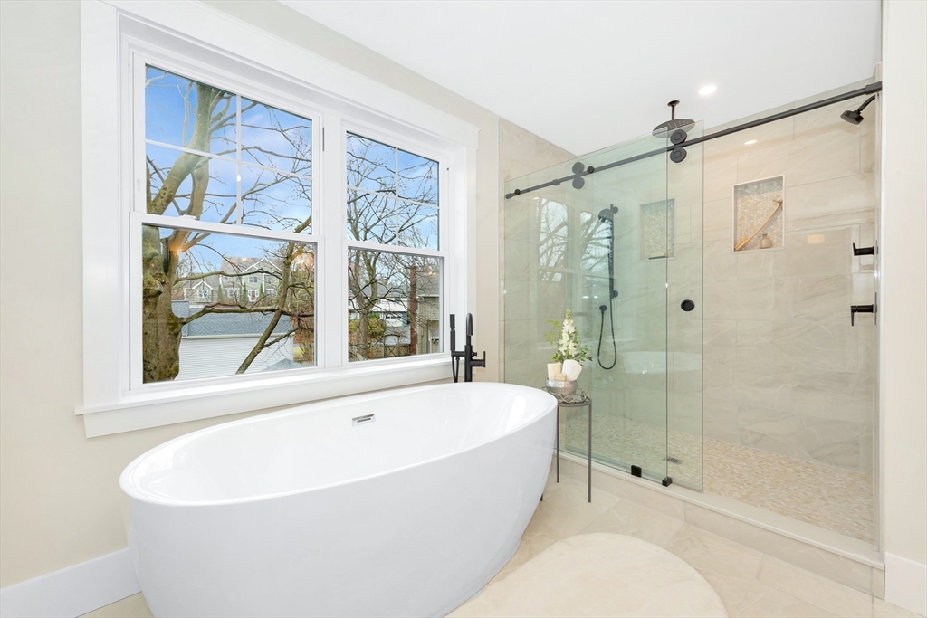 19 Cherokee Road Arlington, MA 02474 - Photo 30 of 42 a white bath tub sitting next to a shower