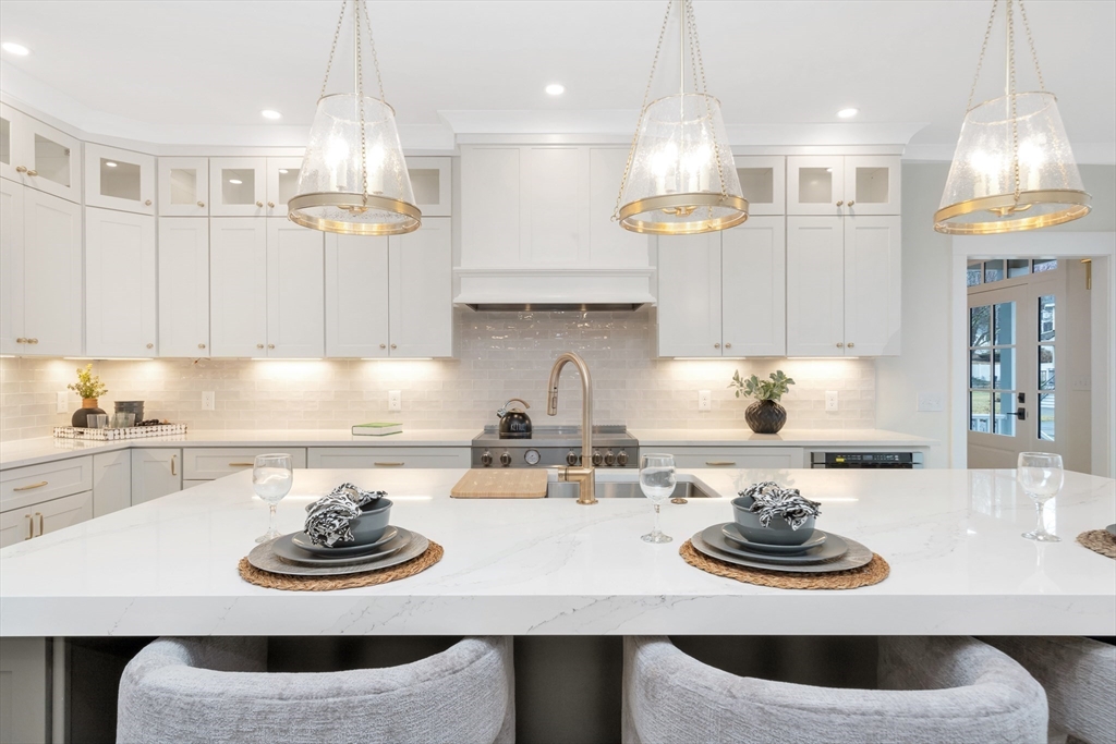 19 Cherokee Road Arlington, MA 02474 - Photo 3 of 42 a kitchen with a sink and stove