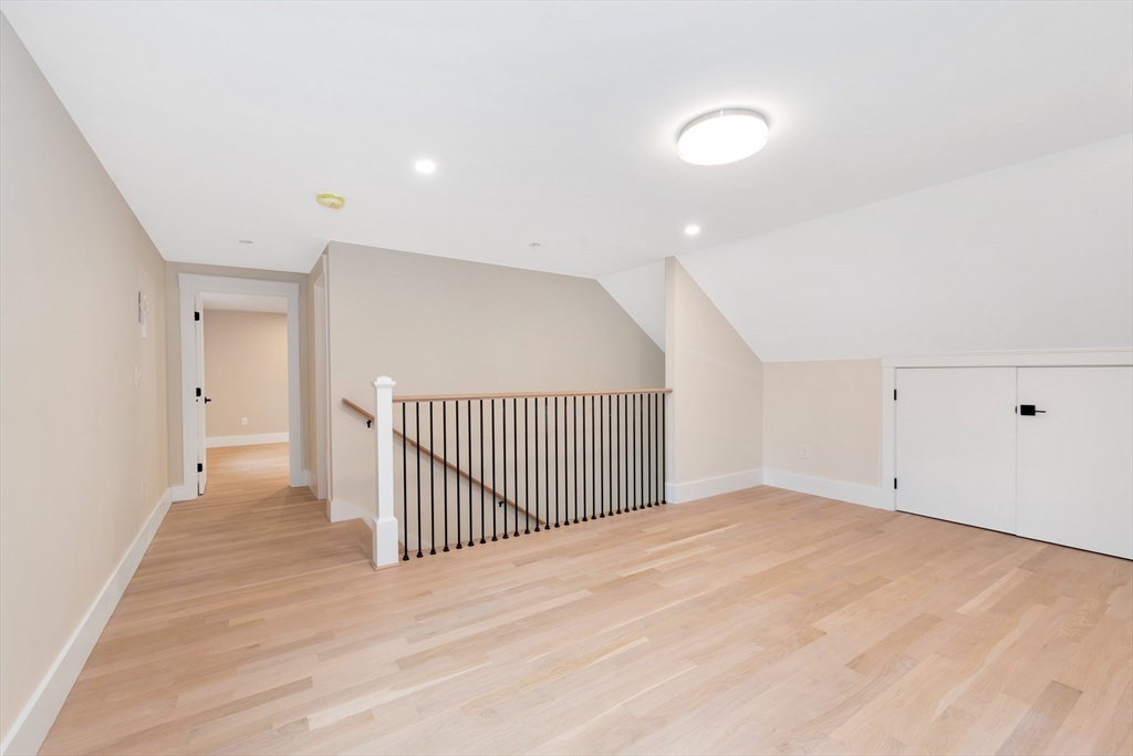 19 Cherokee Road Arlington, MA 02474 - Photo 32 of 42 a view of a room with wooden floor