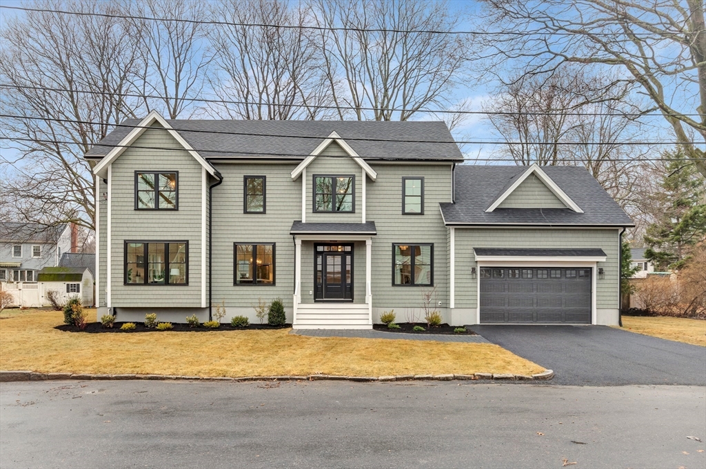 19 Cherokee Road Arlington, MA 02474 - Photo 40 of 42 a front view of a house with a yard