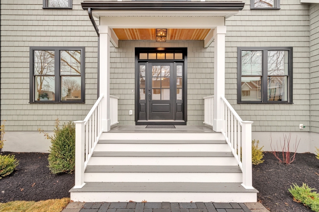19 Cherokee Road Arlington, MA 02474 - Photo 42 of 42 a front view of a house with a window and brick walls