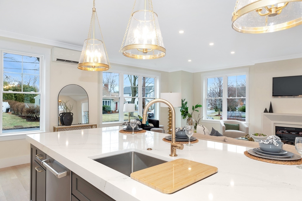 19 Cherokee Road Arlington, MA 02474 - Photo 8 of 42 a kitchen with stainless steel appliances a sink a stove and a wooden floors