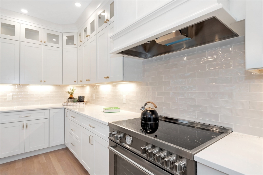 19 Cherokee Road Arlington, MA 02474 - Photo 10 of 42 a kitchen with a sink stainless steel appliances and cabinets