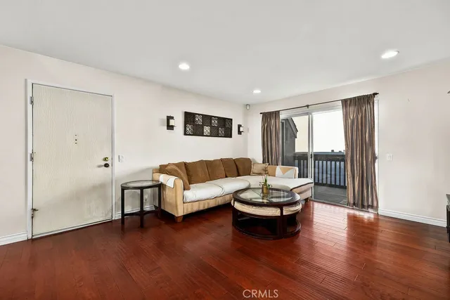 a view of a balcony with wooden floor