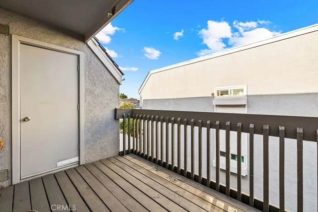 a view of balcony with wooden floor