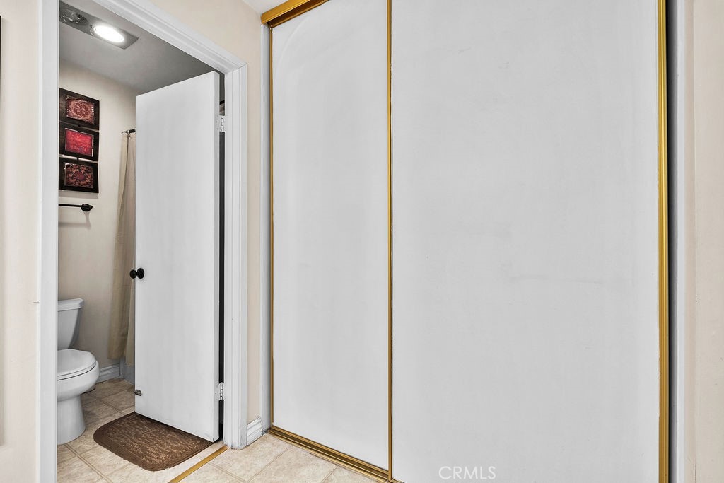 35 Firwood Irvine, CA 92604 - Photo 20 of 35 a bathroom with a granite countertop toilet and a shower