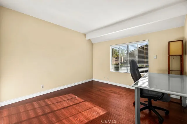 a bathroom with a sink a toilet and a large mirror