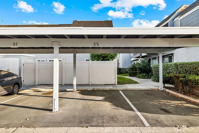 a view of a swimming pool with an outdoor seating and a garden